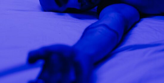 Photo of Man Lying on Bed